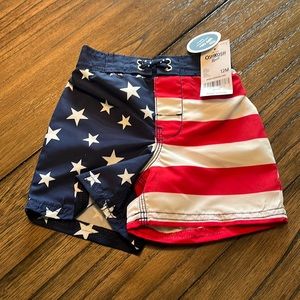 Brand new Oshkosh swim trunks 9-12 mos Independence Day blue and red